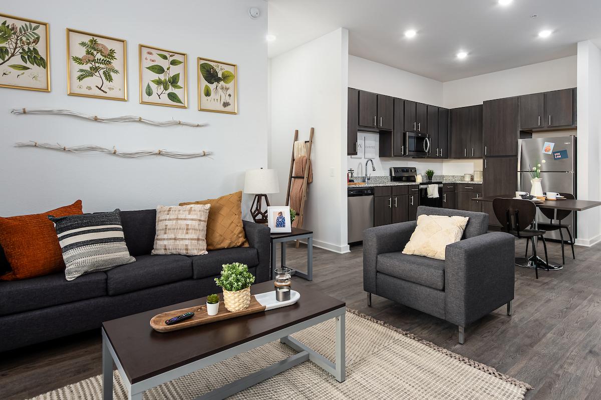 Furnished living room and kitchen at Anthem House in Gainesville